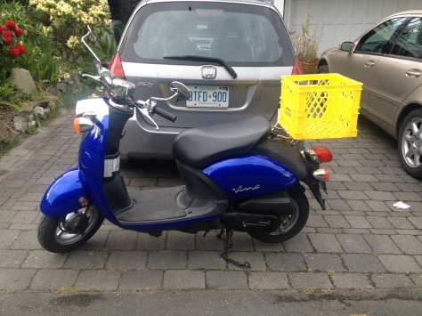 You know you're back among your people when you buy a scooter with a milk crate zip tied to the back